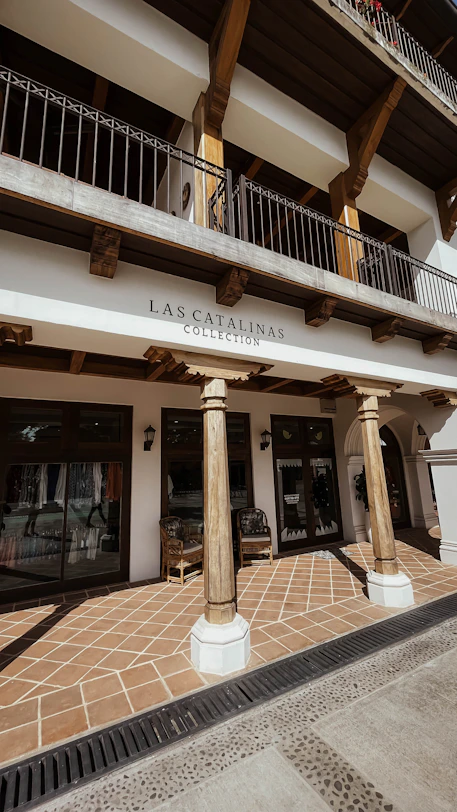 the front of a building with columns and a balcony