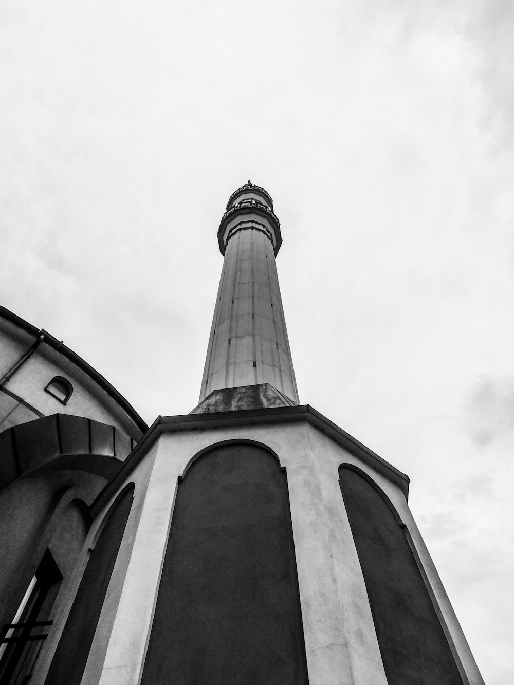 a black and white photo of a lighthouse