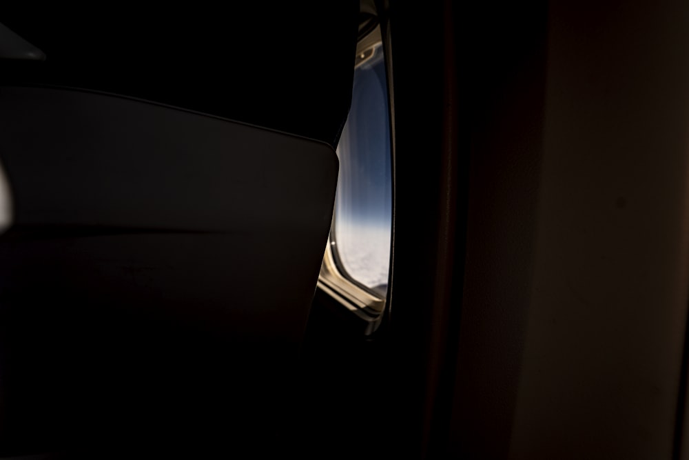 a view of the wing of an airplane through a window