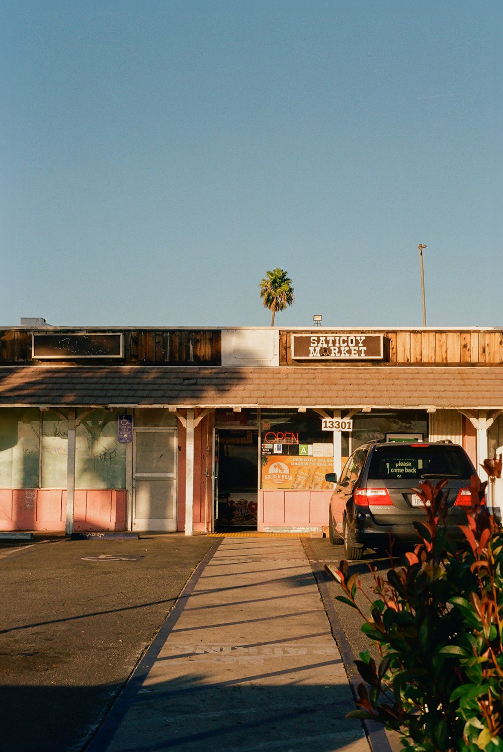 a parking lot with a car parked in front of it