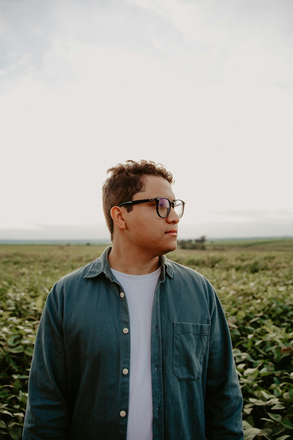 a man standing in a field of crops