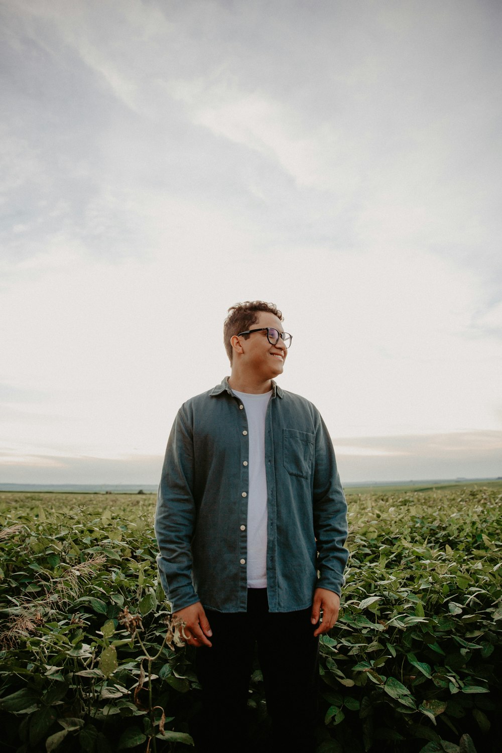 a man standing in the middle of a field