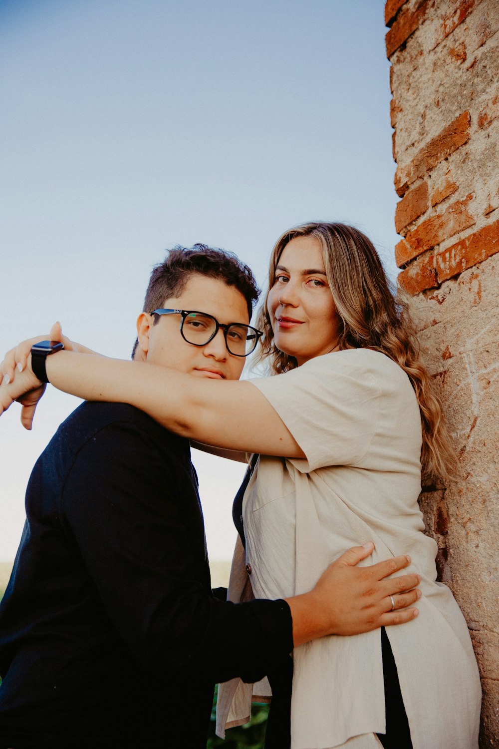 a man and a woman hugging each other