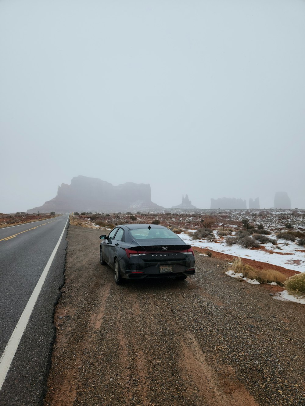 a car is parked on the side of the road