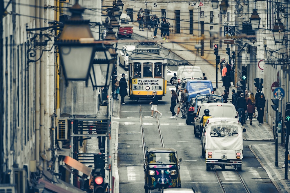 a city street filled with traffic next to tall buildings