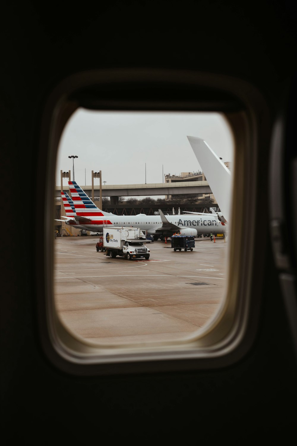 a view of an airport from an airplane window