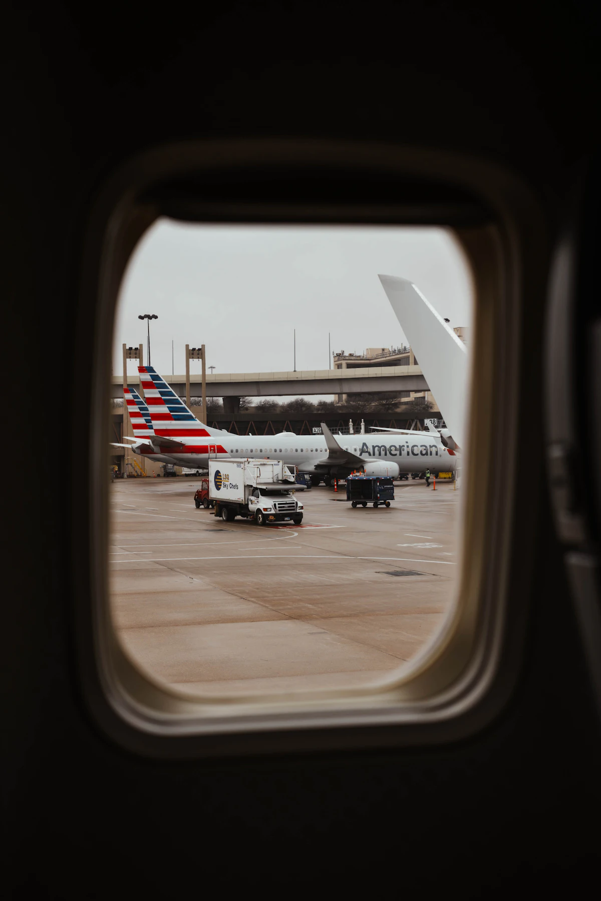 An airport seen from an airplane window