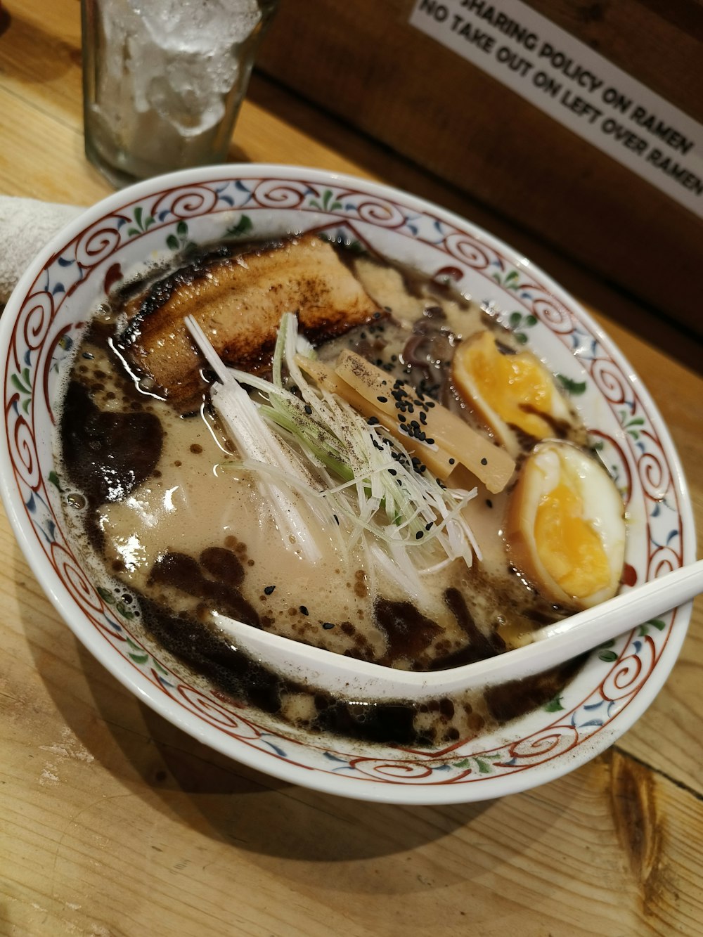 a bowl of soup with meat and vegetables