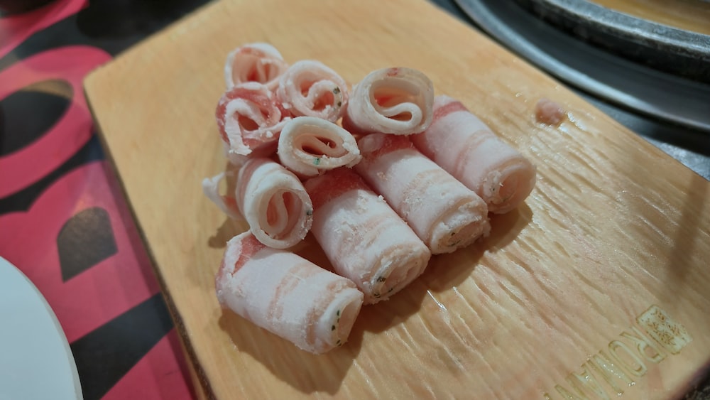 a bunch of food that is on a cutting board