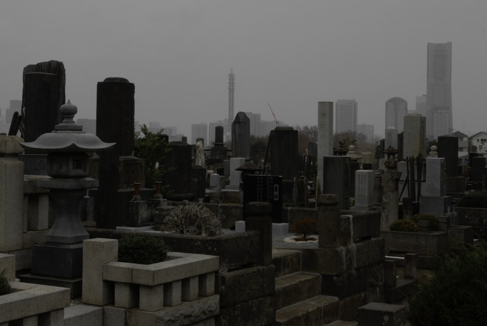 a cemetery with a city in the background