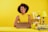 a woman sitting at a table with a laptop