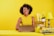 a woman sitting at a table with a laptop