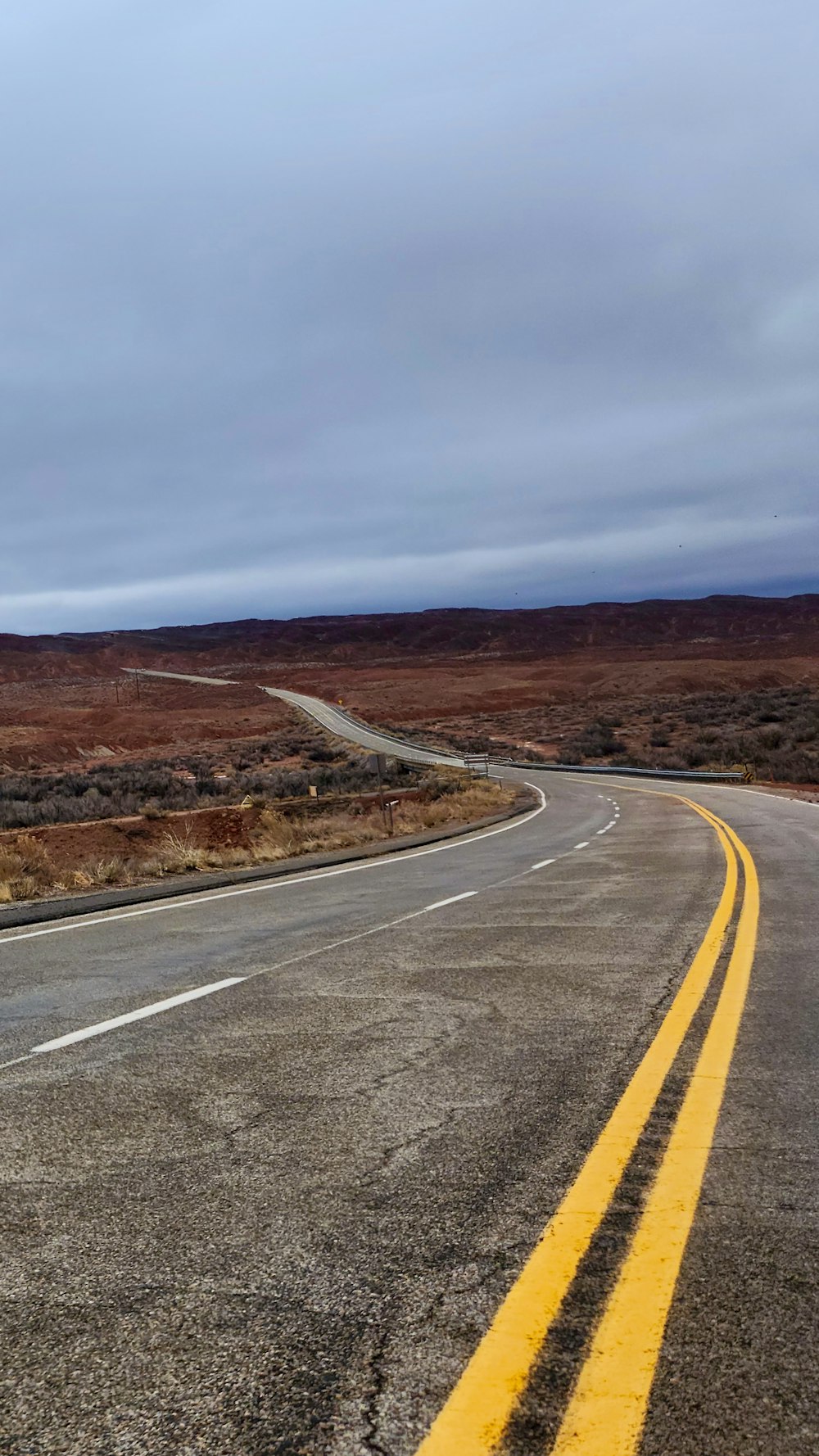 an empty road in the middle of nowhere