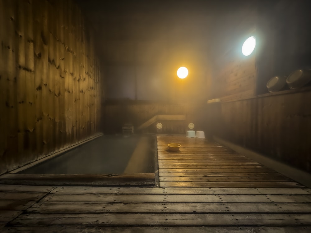 a room with a wooden floor and a hot tub