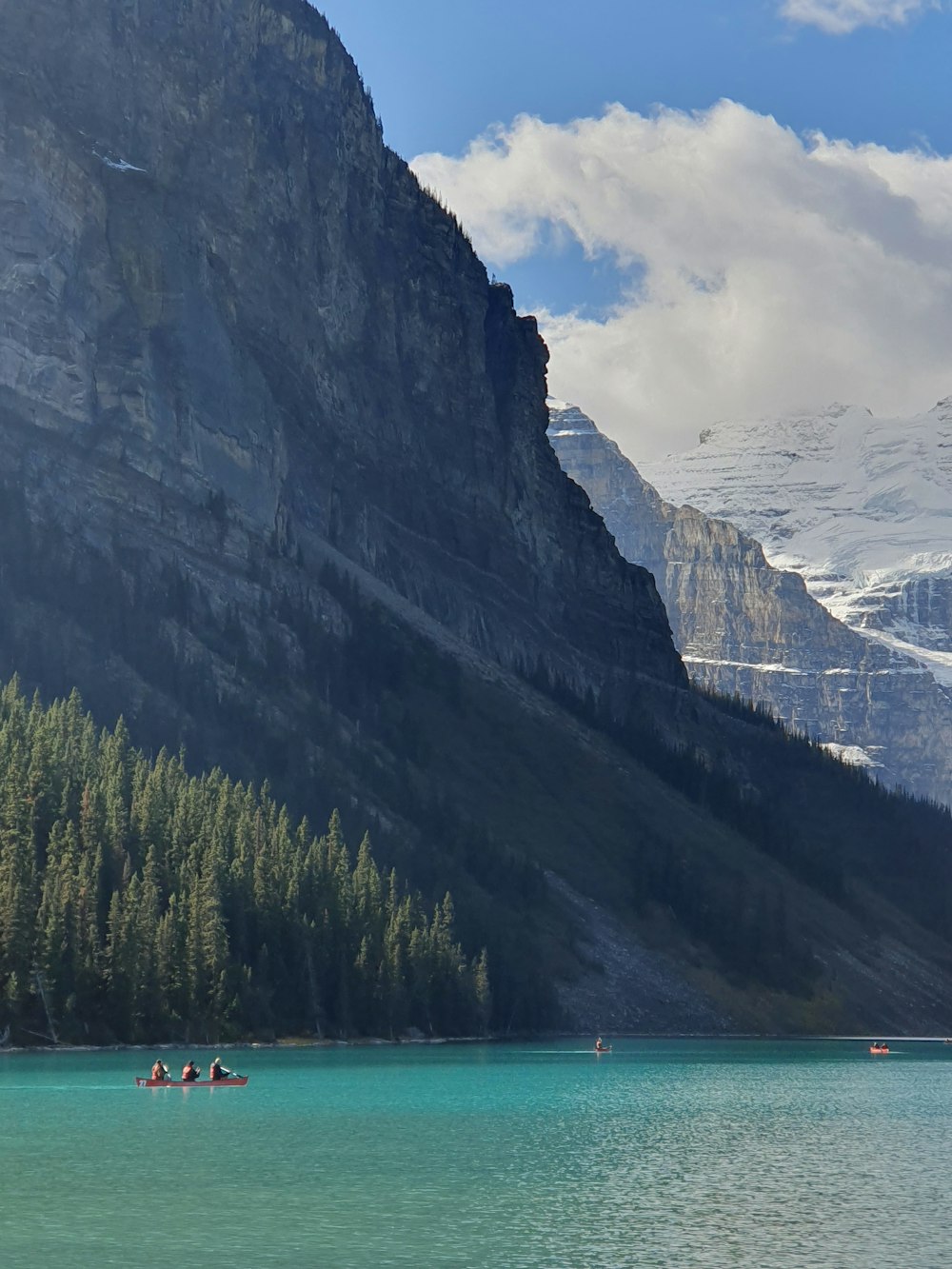 a group of people in a boat on a lake