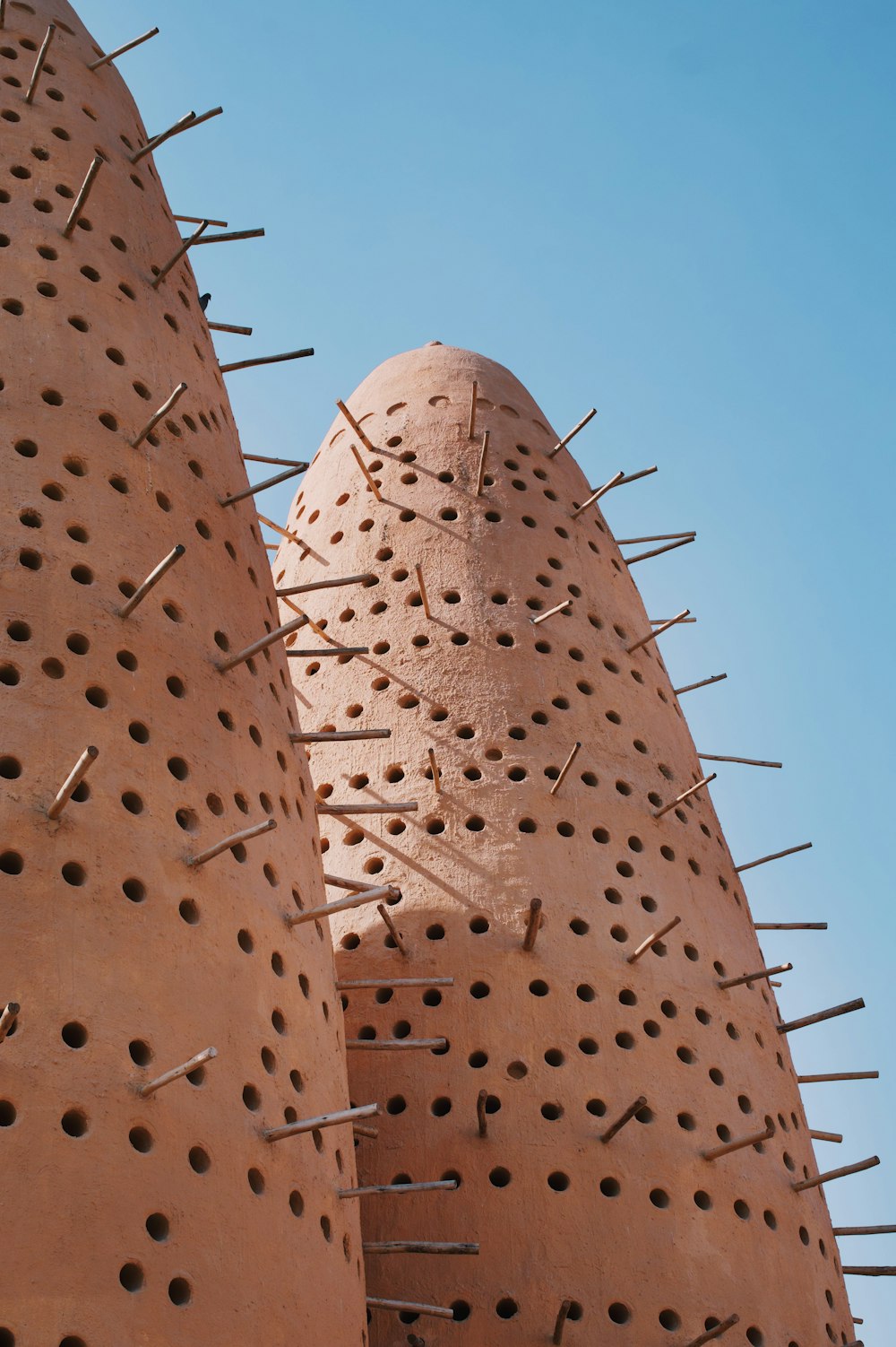 a close up of a building with spikes on it