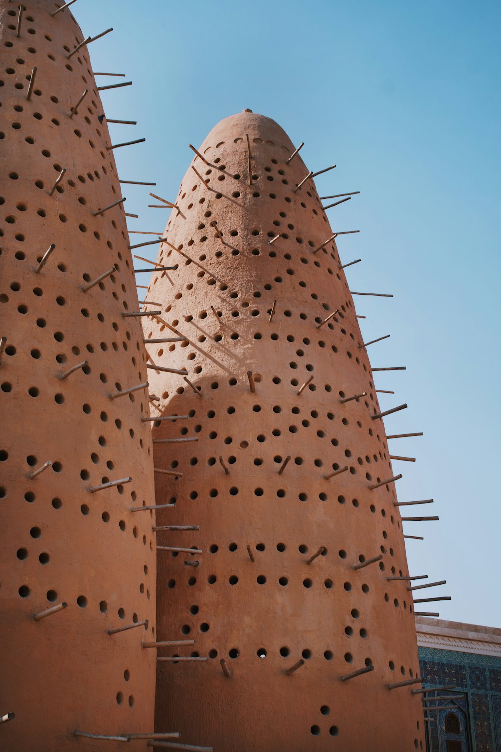 a close up of a building with spikes on it