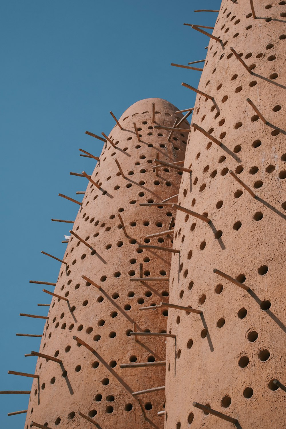 a close up of a building with spikes on it