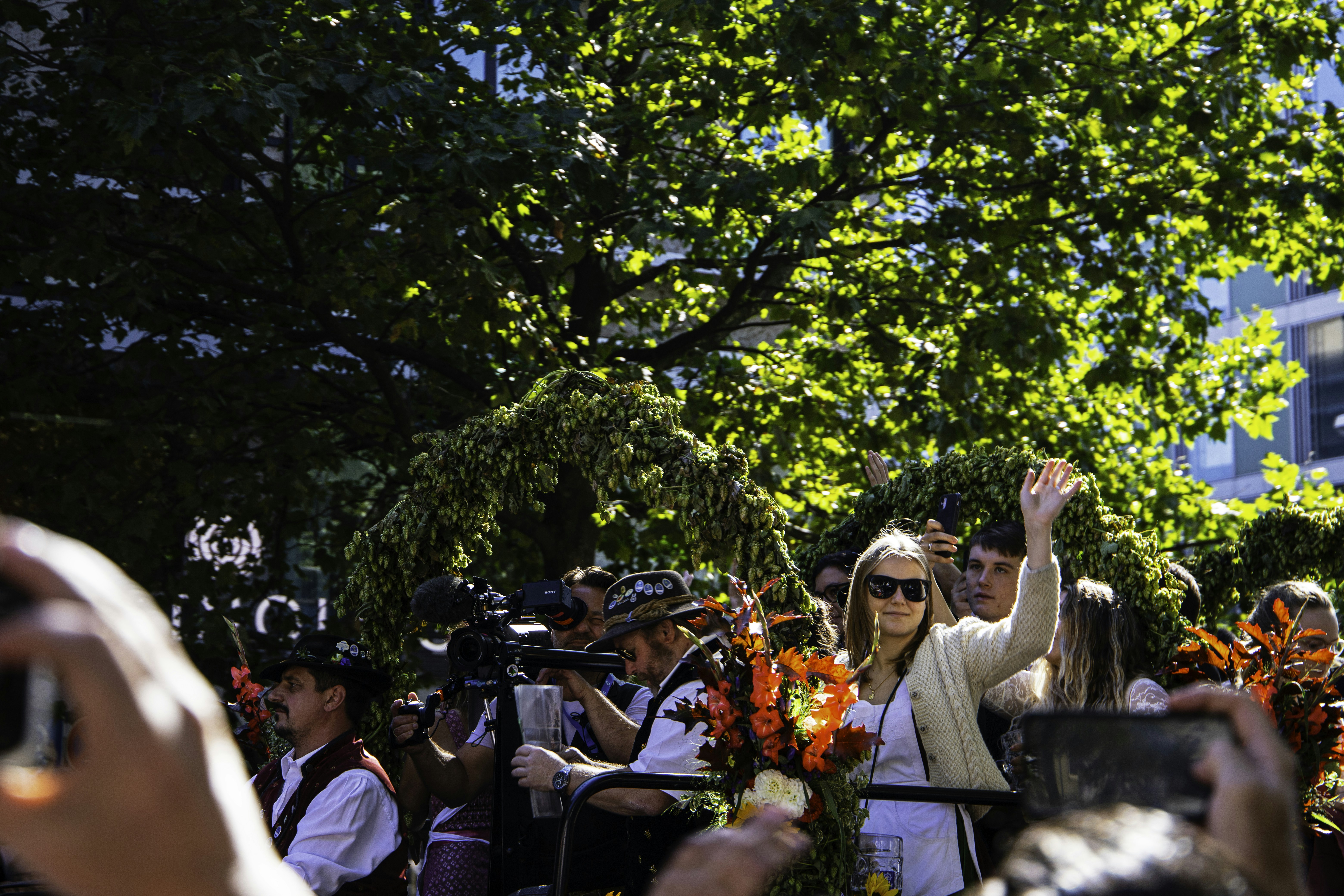 a group of people standing around each other, 