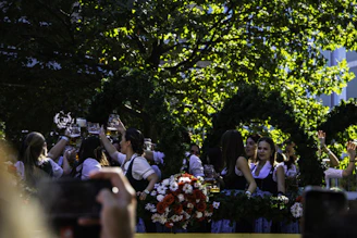 a group of people taking pictures of a woman
