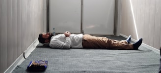 a man laying on the floor in a room