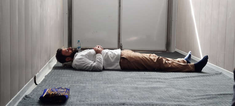 a man laying on the floor in a room