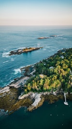 an aerial view of an island in the middle of the ocean