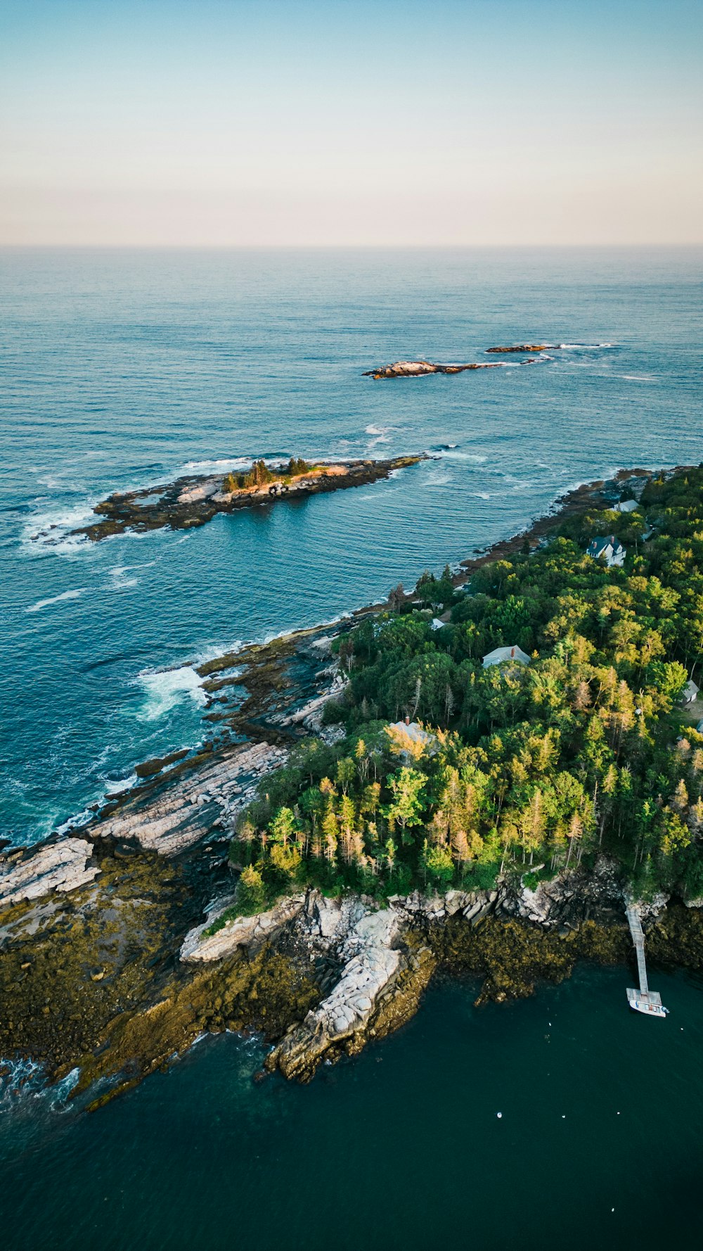 an aerial view of an island in the middle of the ocean