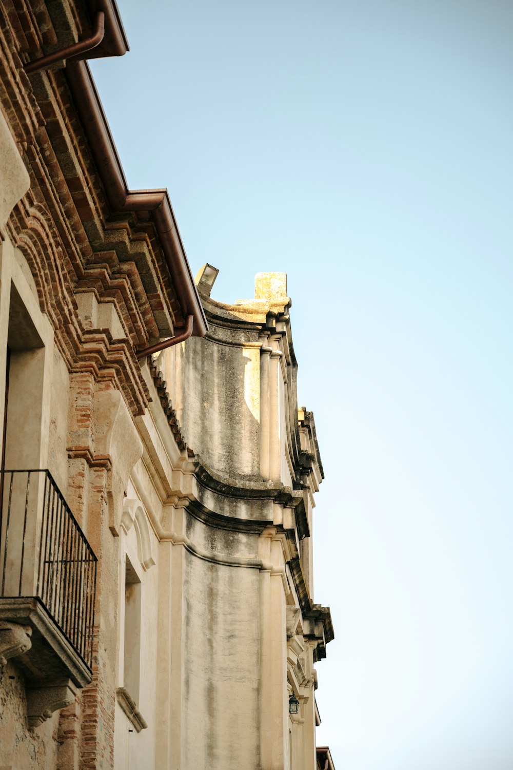 an old building with a balcony and balconies