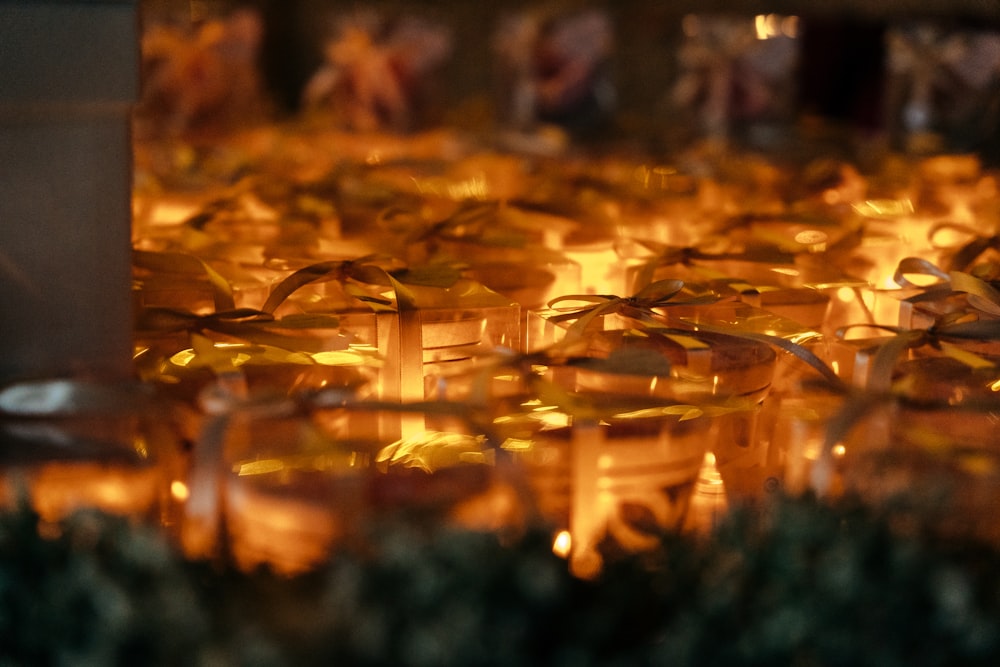 many candles are lit in a row on a table