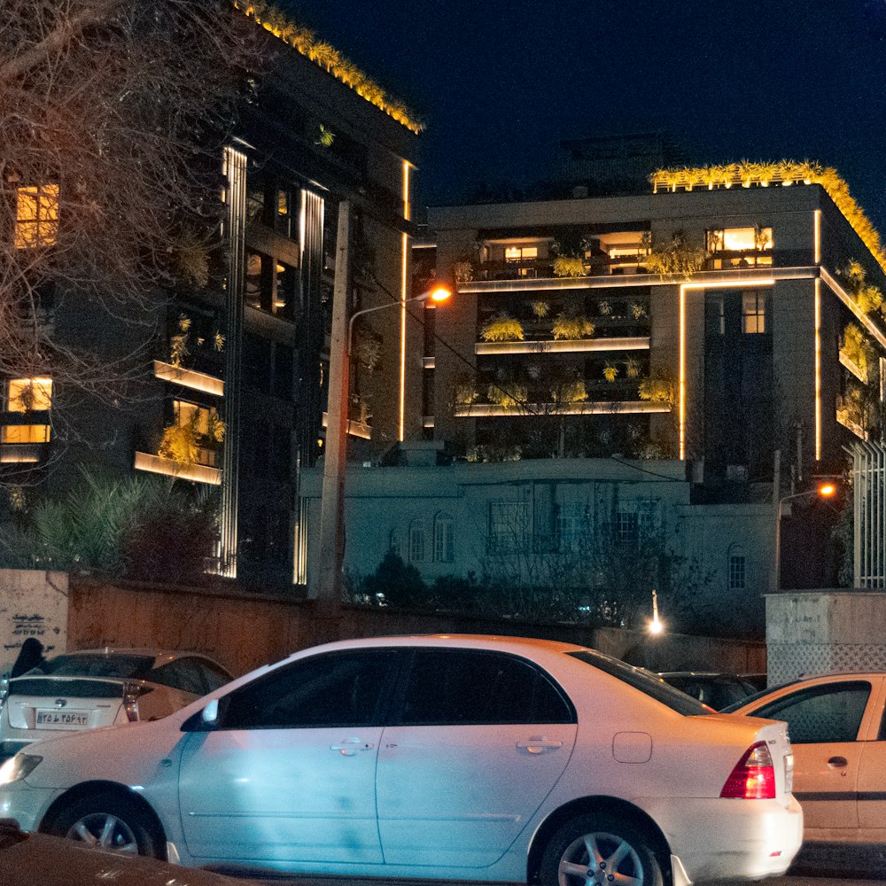 a couple of cars parked next to each other on a street