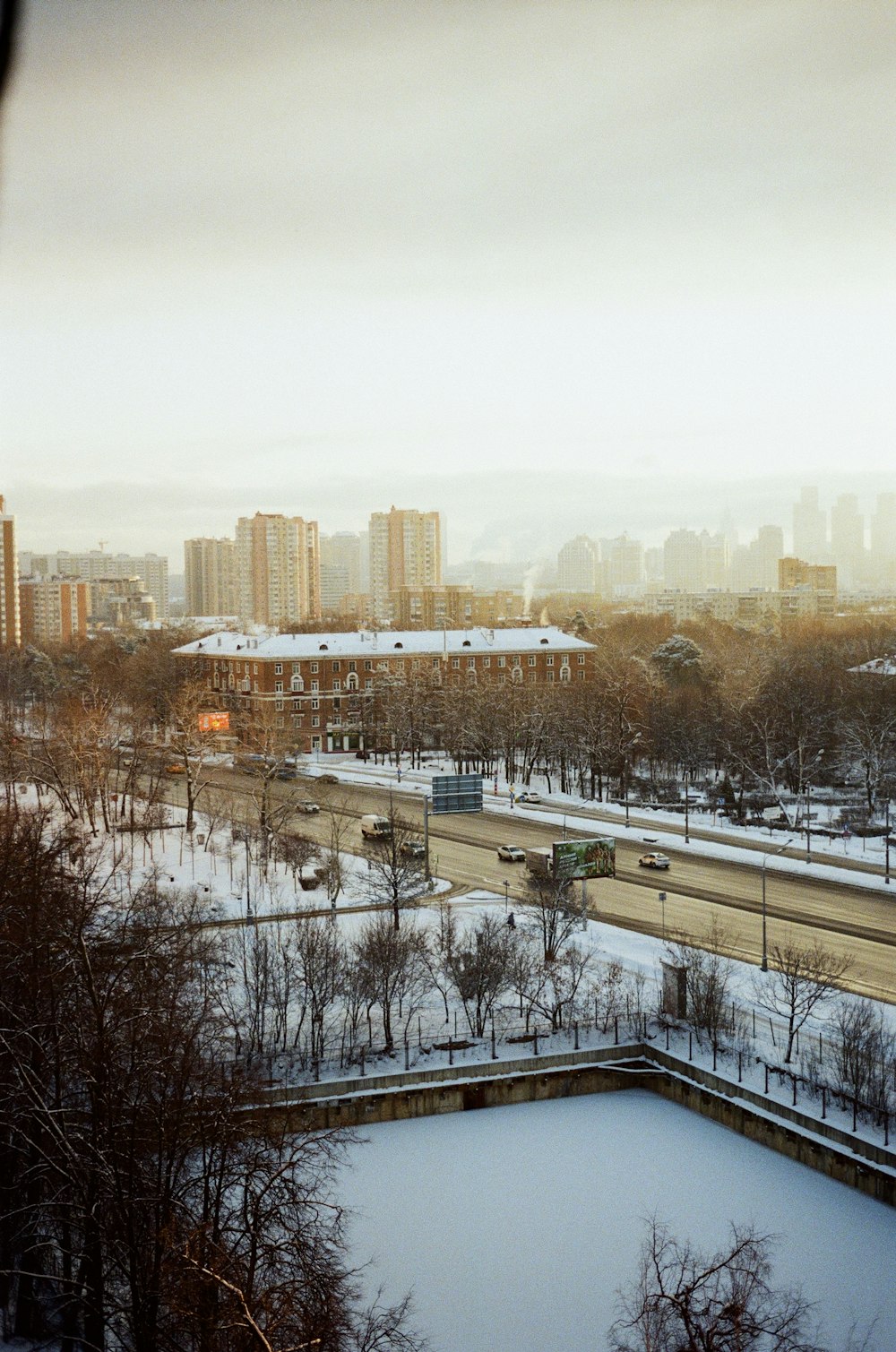 a view of a city with a lot of snow on the ground