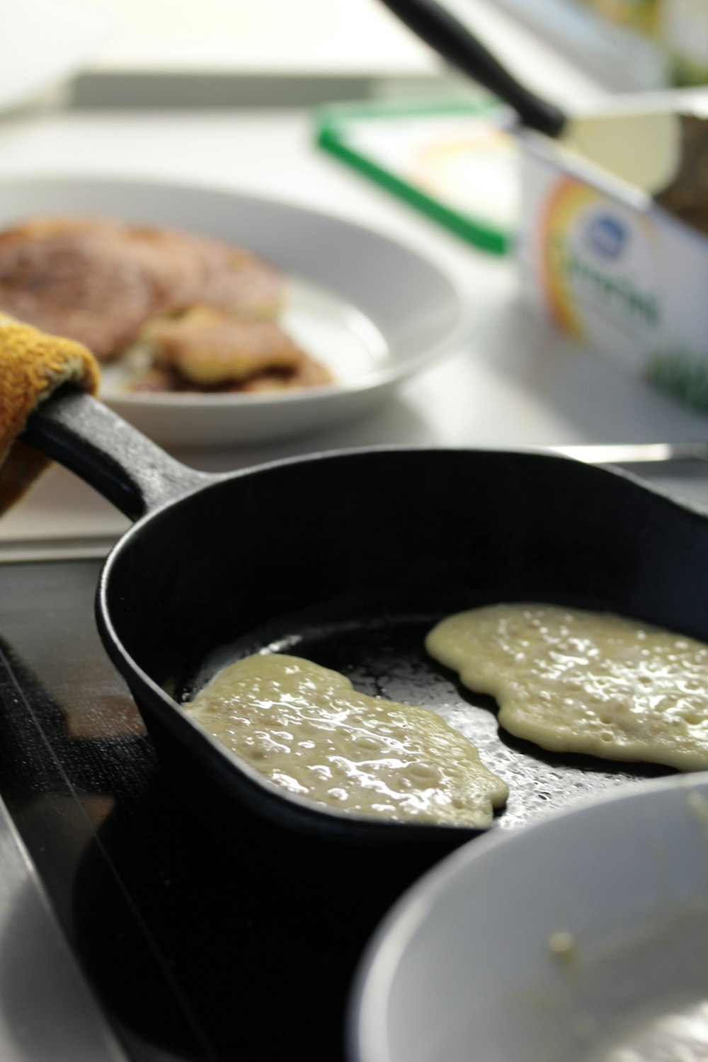 a frying pan filled with food on top of a stove