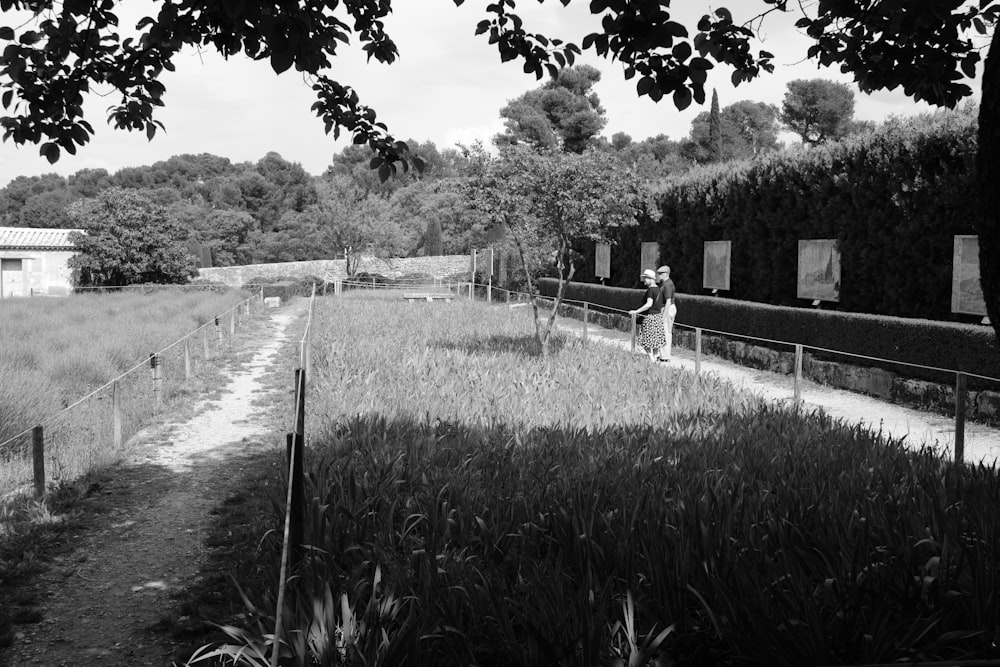 a black and white photo of a person in a field