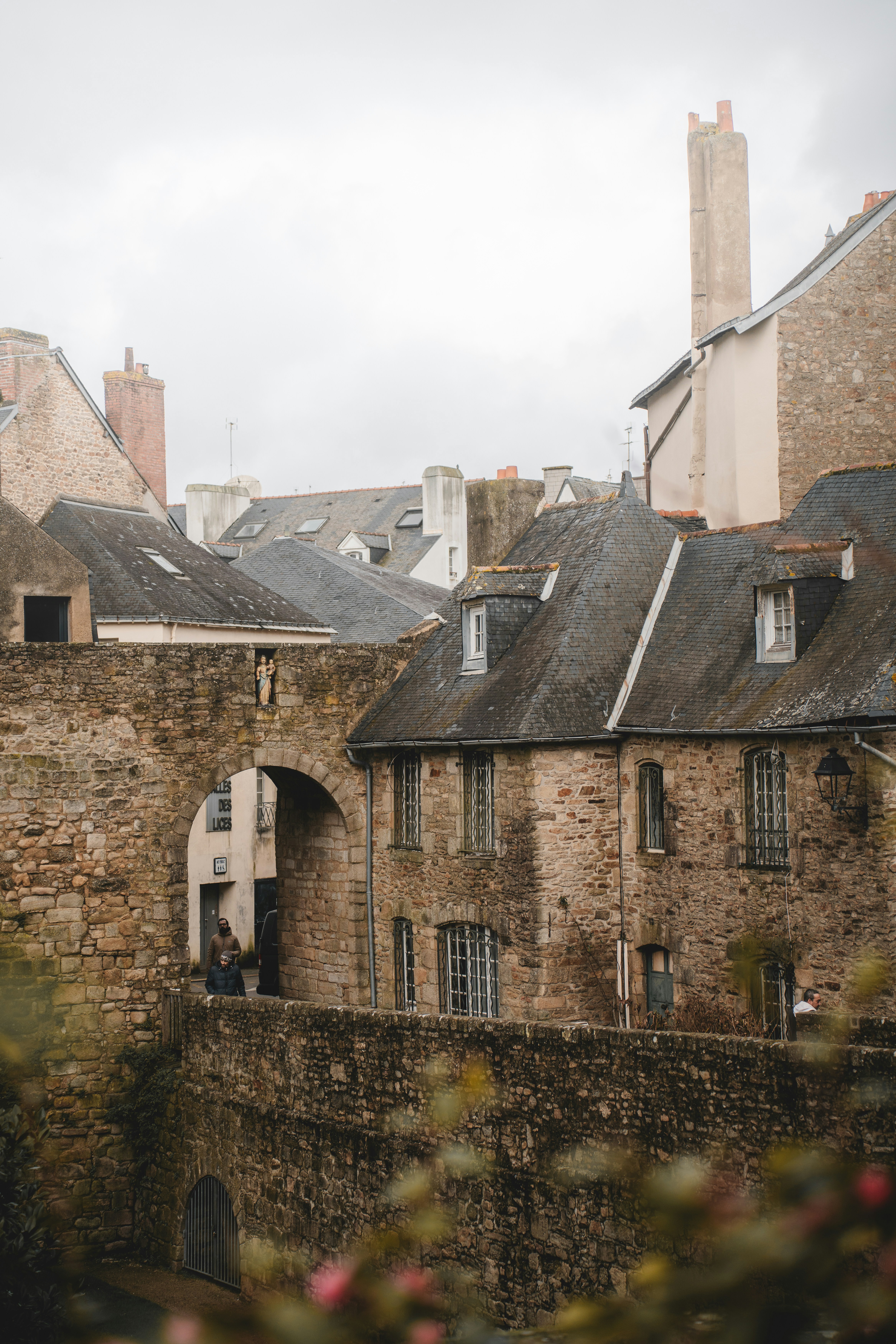 an old brick building with a clock tower in the background