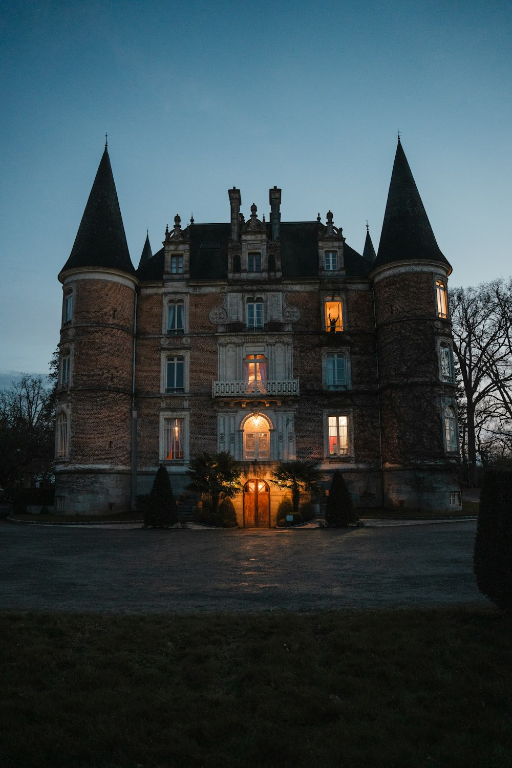 a large building with a lot of windows at night