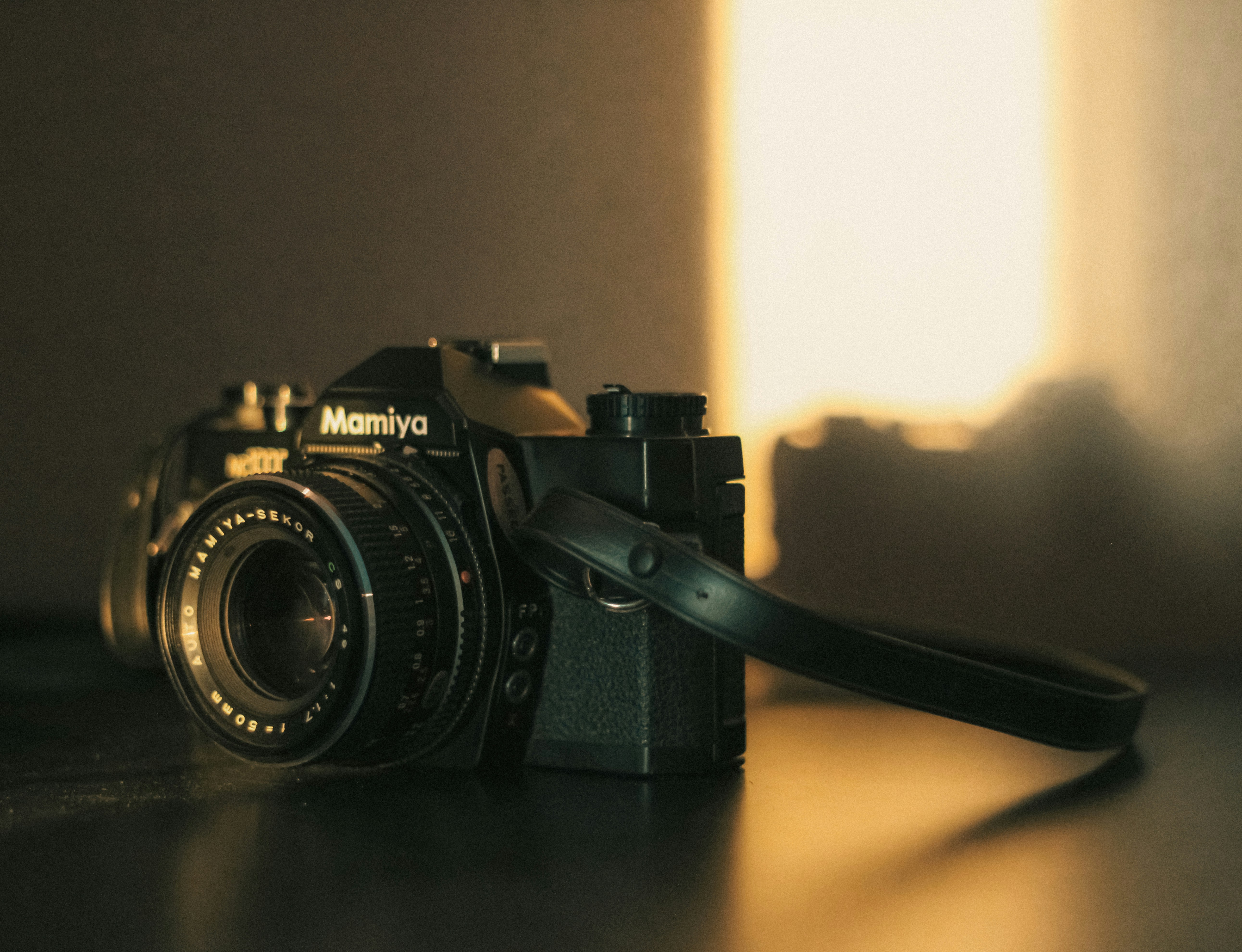 a camera sitting on top of a wooden table