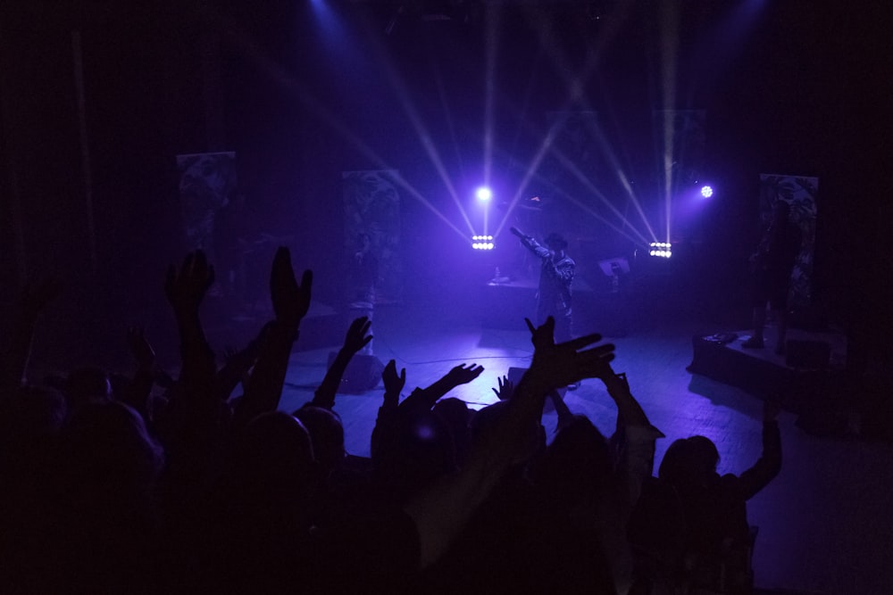 a group of people standing on top of a stage