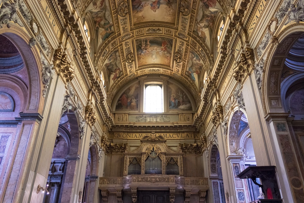 a church with a very high ceiling and a painting on the ceiling