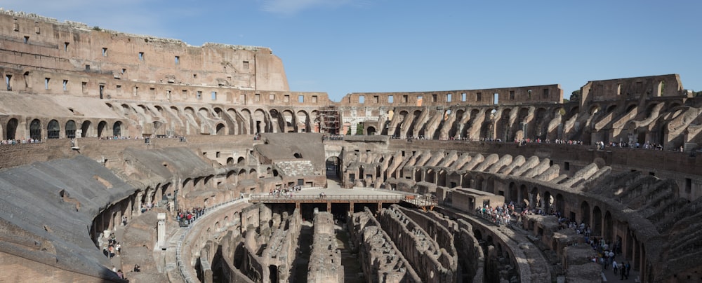 the interior of a large building with people inside of it