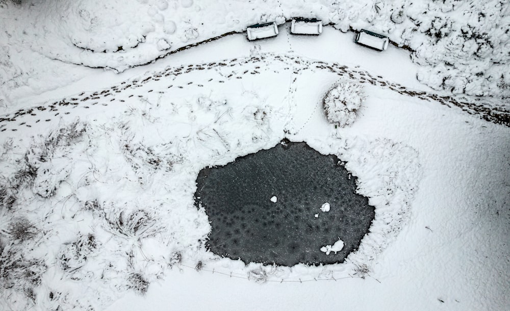 an aerial view of a snow covered field