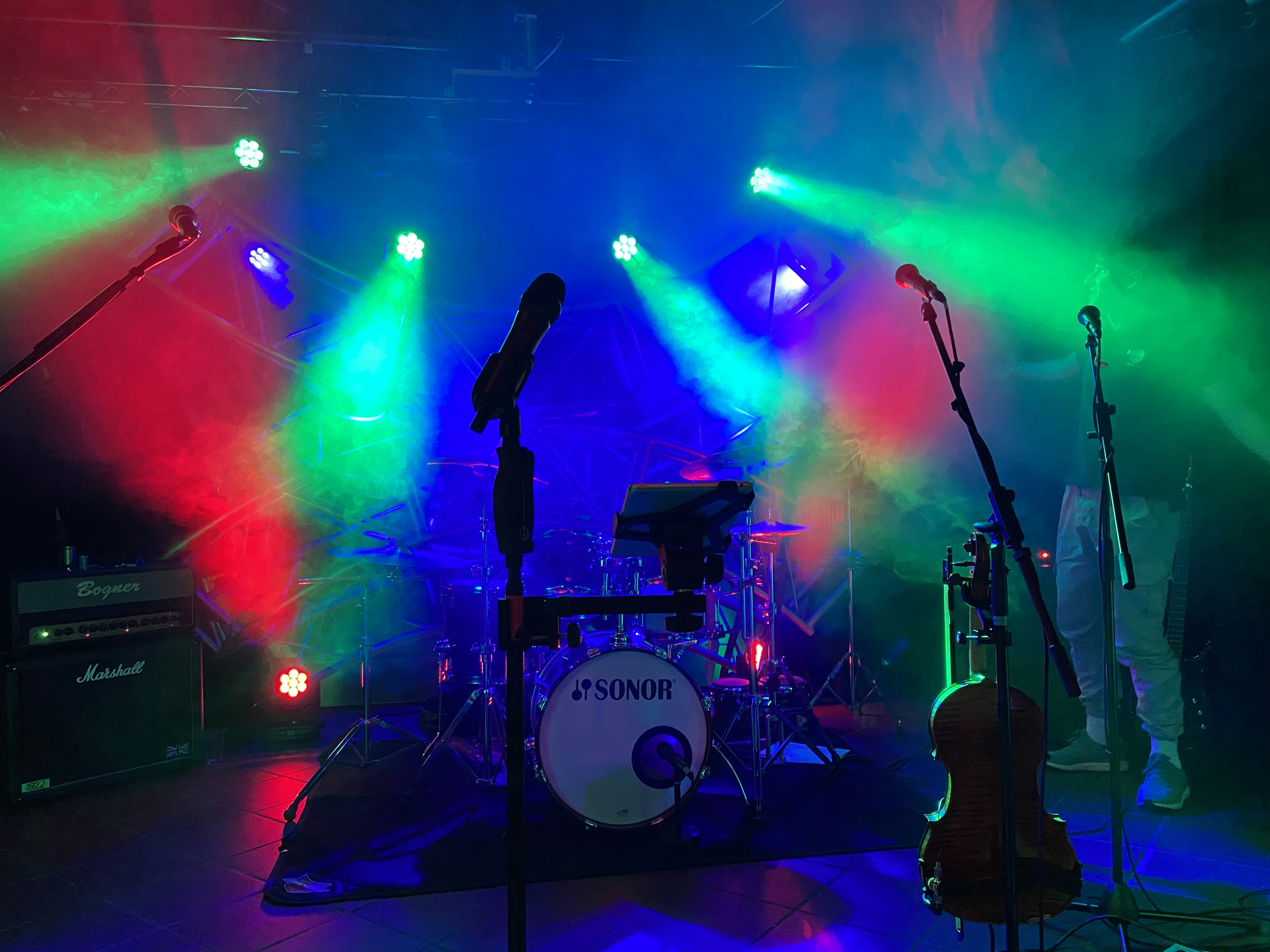 A group of musical instruments on a stage photo – Free Blue Image on ...
