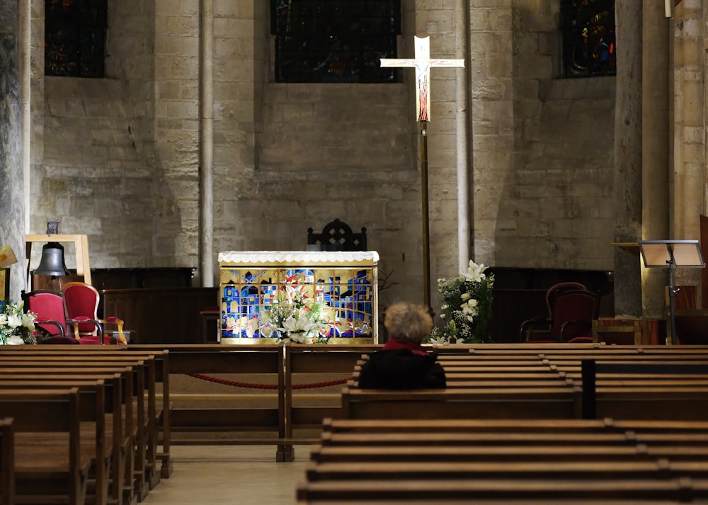 a small child sitting in a church pew