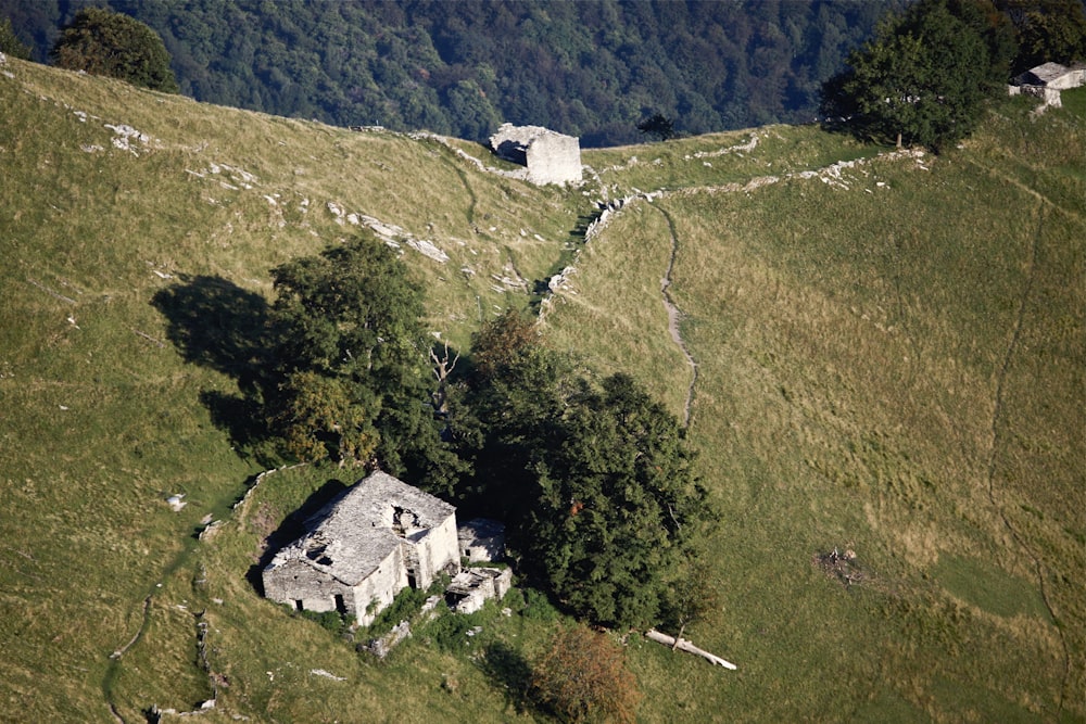 an aerial view of a house on a hill