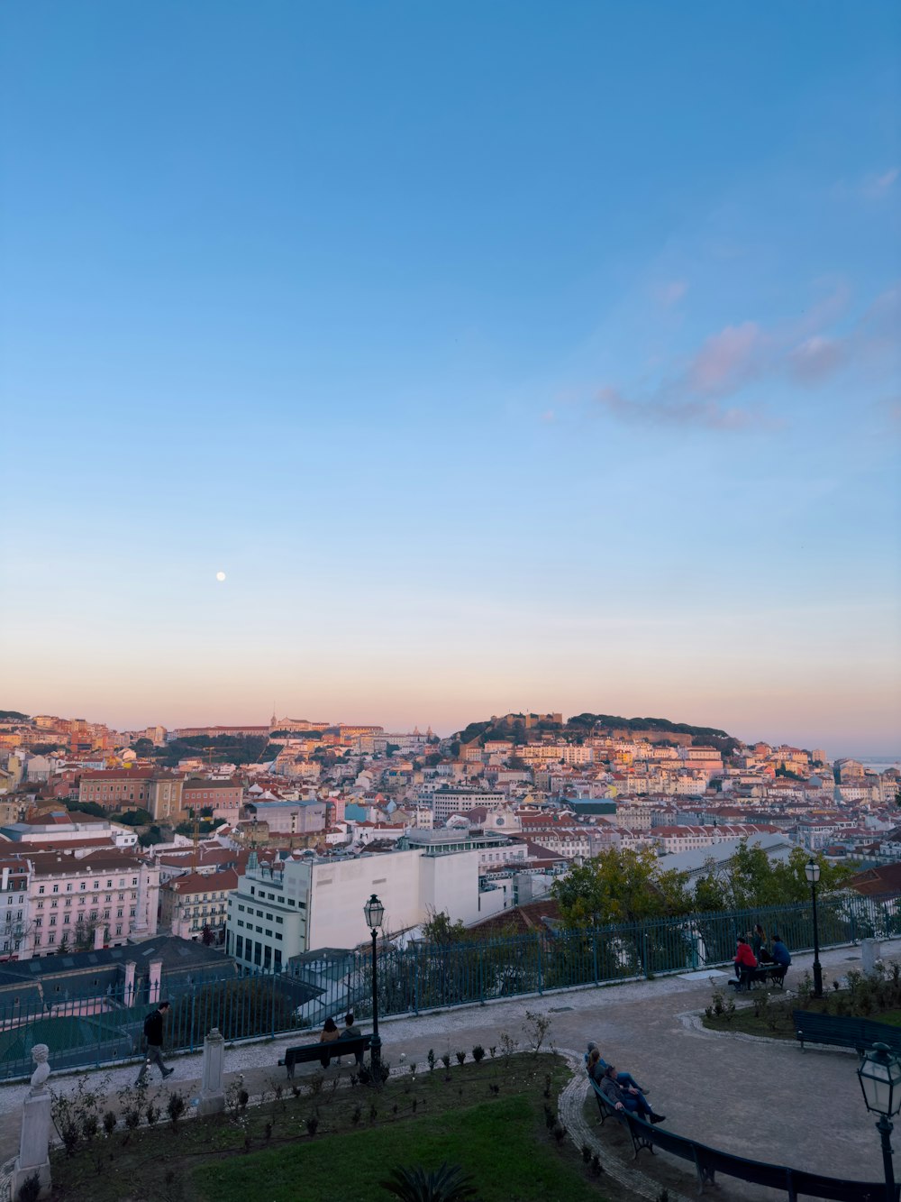 a view of a city from the top of a hill