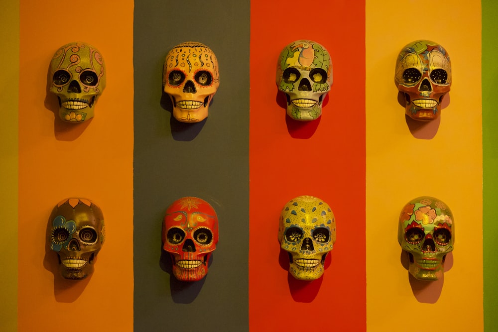 a group of skulls that are on a wall