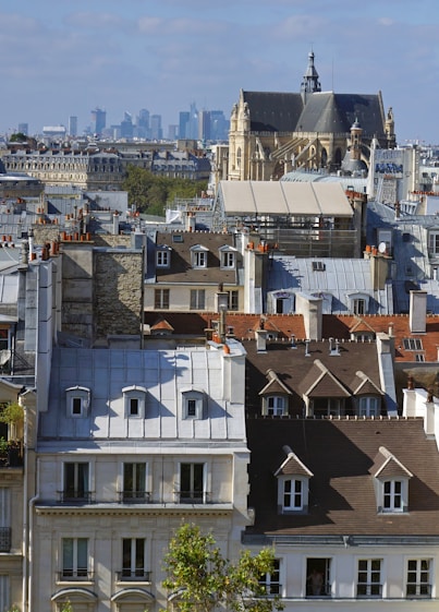 a view of a city with buildings and a clock tower