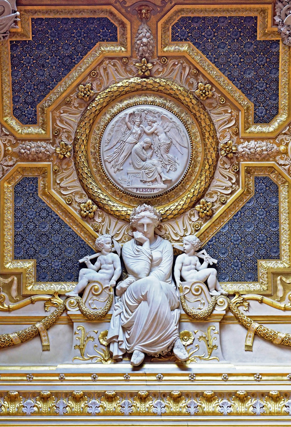 a statue of a woman surrounded by other statues