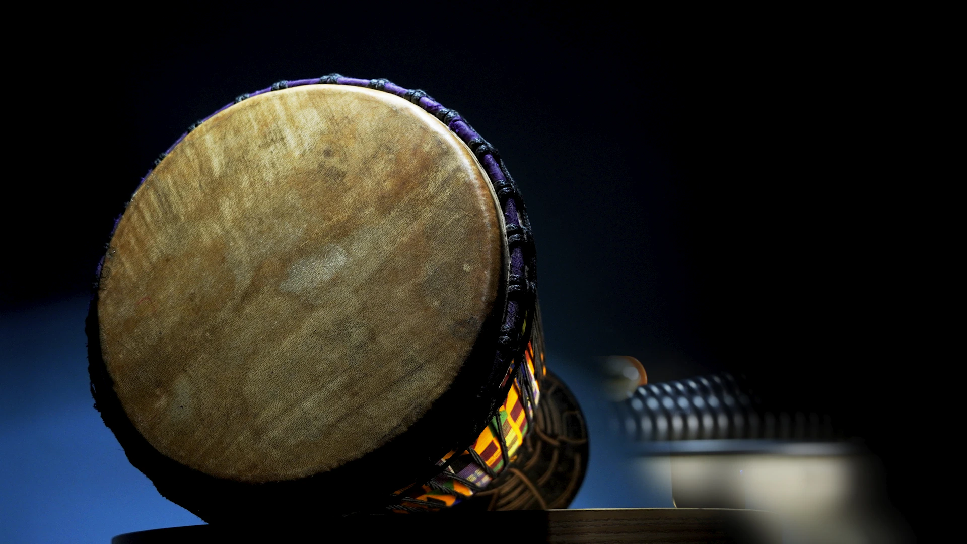 a wooden drum sitting on top of a table