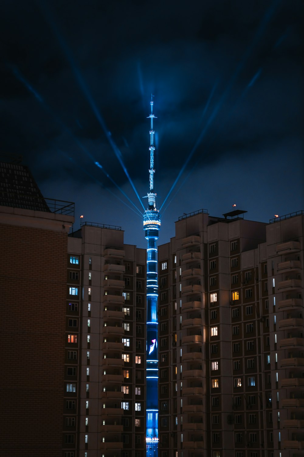 a tall building lit up in the night sky